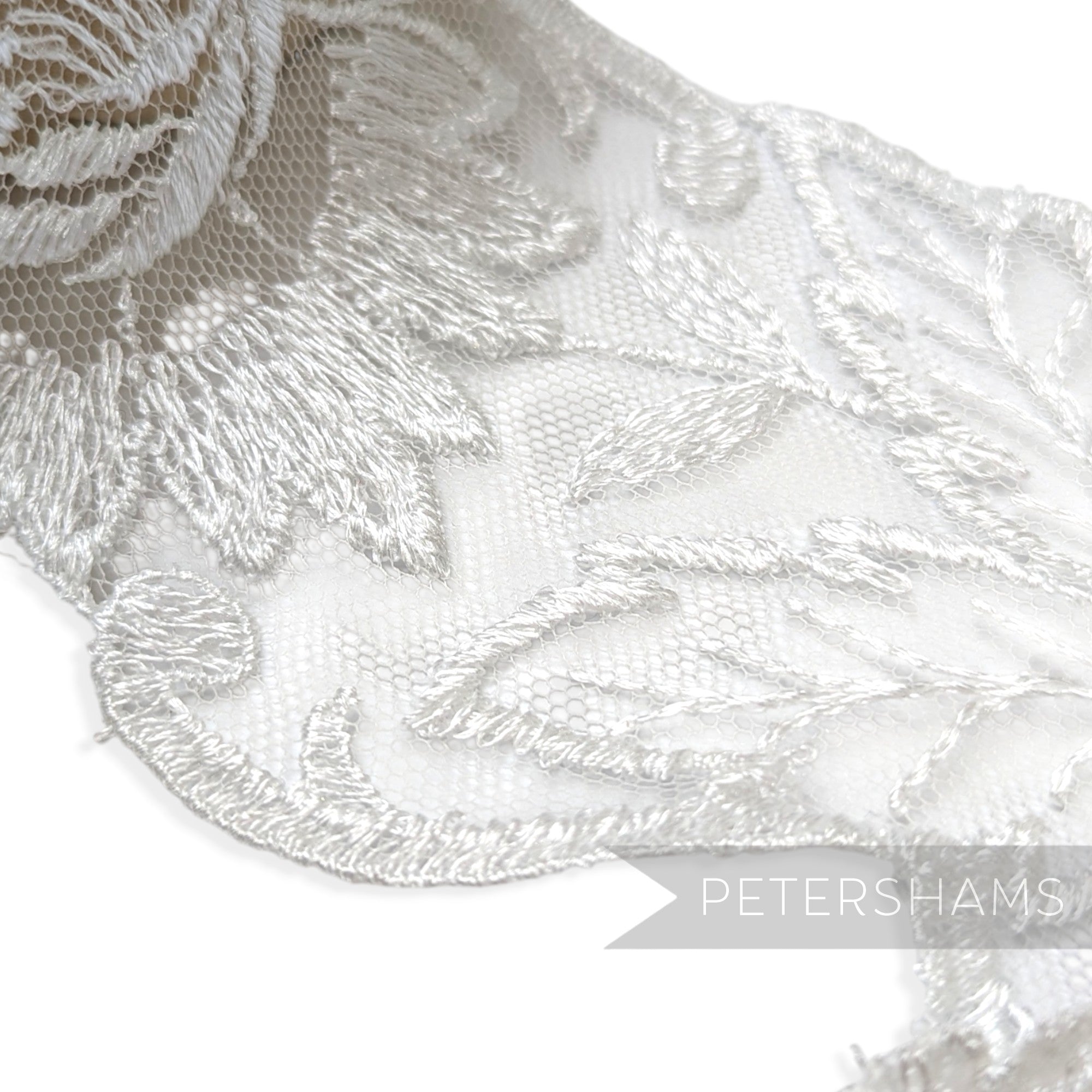 Petershams Millinery Supplies white sheer lace trim with embroidered floral and leaf pattern for bridal veils