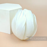 Petershams Millinery Supplies large white tulip-shaped feather flower made from cupped goose nagorie feathers.