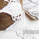 Petershams Millinery Supplies white guipure lace trim featuring a large flowing leaf design for bridal headdresses.
