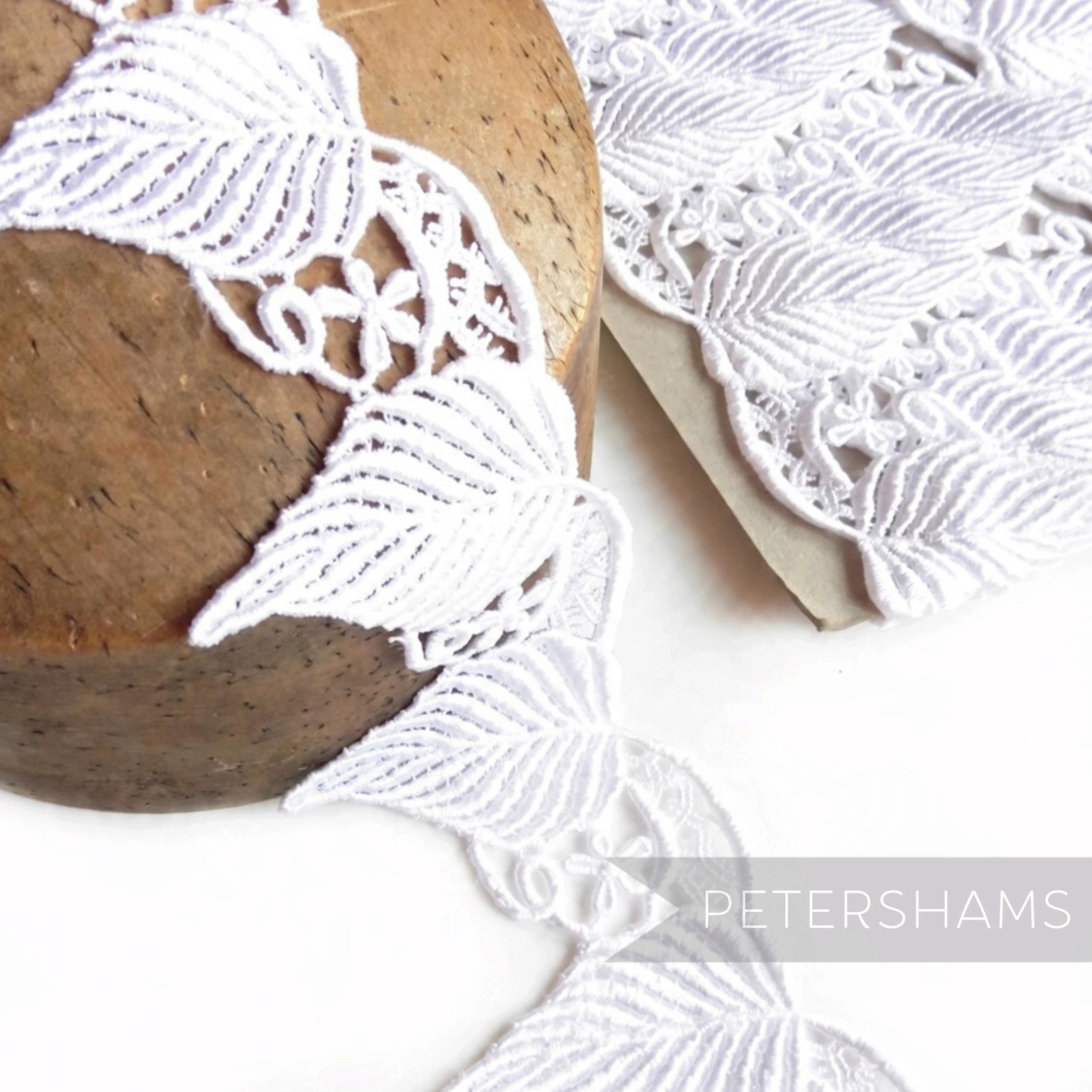 Petershams Millinery Supplies white guipure lace trim with a large leaf design for bridal headdresses and appliques.