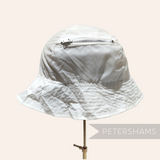 Petershams Millinery Supplies vintage white nylon children's bucket hat with a built-in zippered storage pouch.