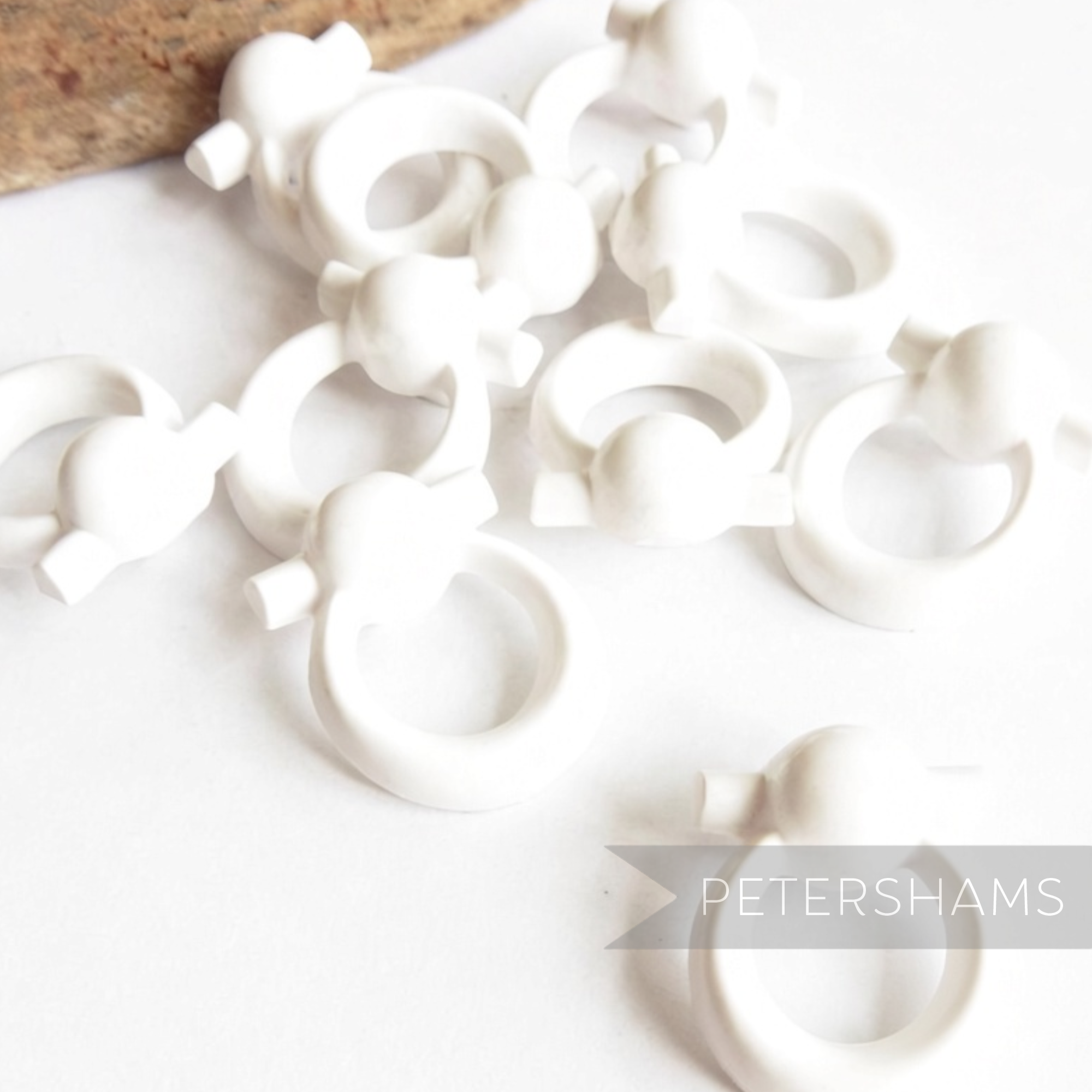 Petershams Millinery Supplies vintage 1960s white plastic door knocker style sewing buttons in a pack of ten