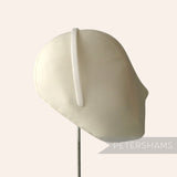 Petershams Millinery Supplies white plastic headband core blank on a mannequin head for DIY craft projects