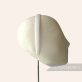 Petershams Millinery Supplies white plastic headband core blank on a fabric mannequin head for DIY craft projects