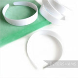 Petershams Millinery Supplies white plastic headband core blanks for DIY craft and millinery projects.