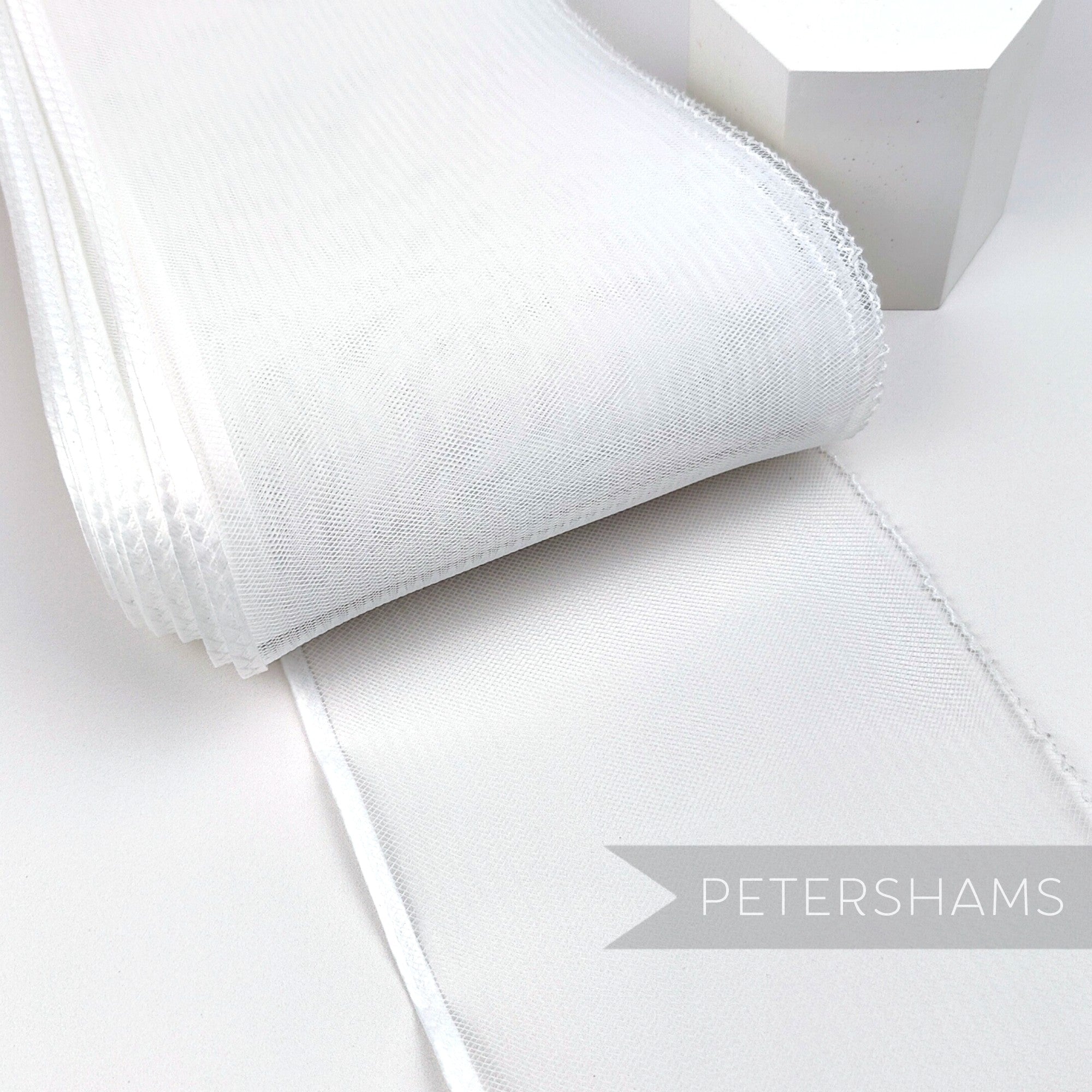 Petershams Millinery Supplies white 15cm wide crinoline ribbon with a shiny polybraid edge for hat making