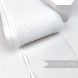Petershams Millinery Supplies white 15cm wide crinoline ribbon with a shiny polybraid edge for hat making