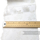 Petershams Millinery Supplies white sheer lace trim with rose and dot pattern and scalloped edge, 17cm wide.