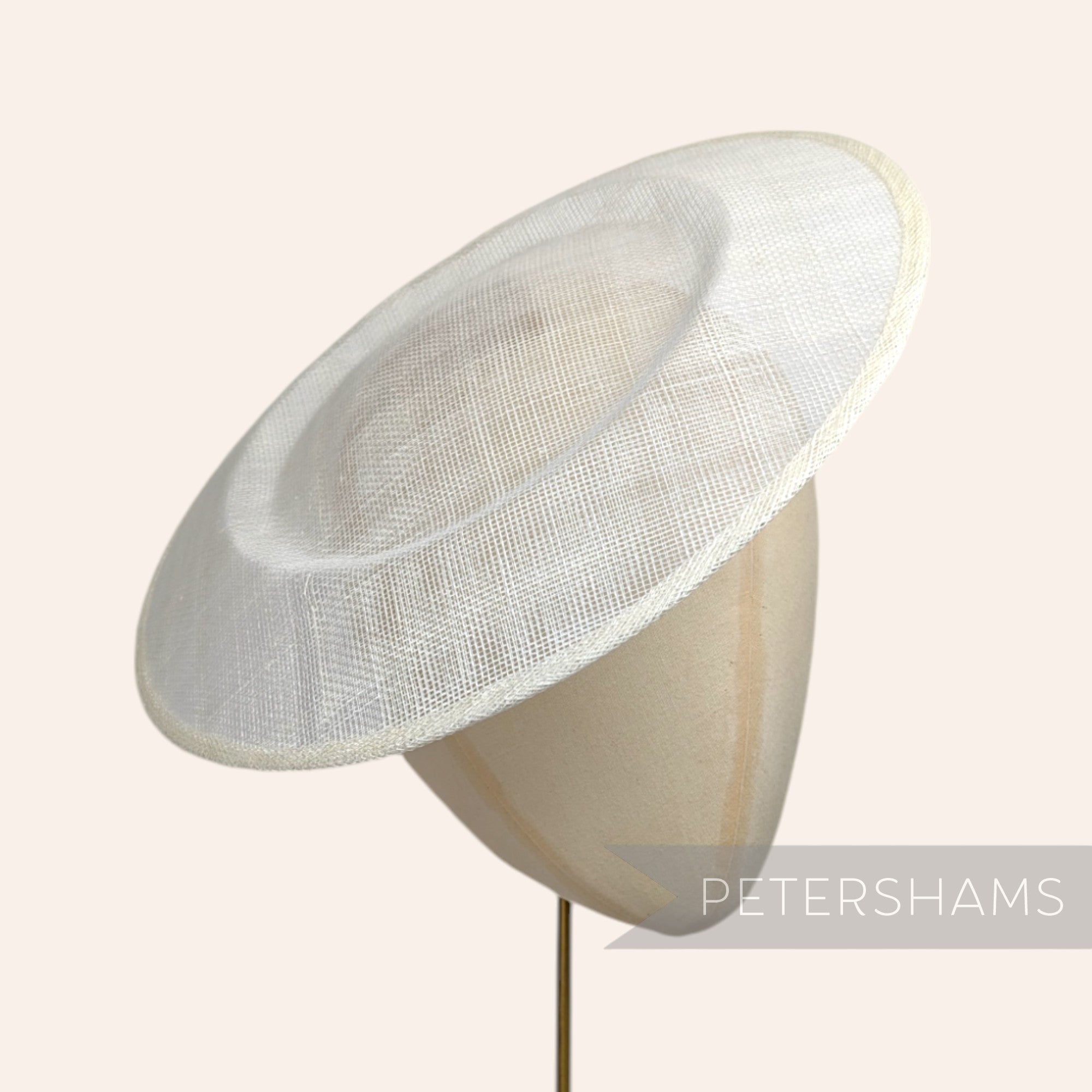 Petershams Millinery Supplies large white round sinamay fascinator hat base on a millinery mannequin head