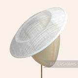 Petershams Millinery Supplies white 29cm round sinamay saucer fascinator hat base on a millinery head block