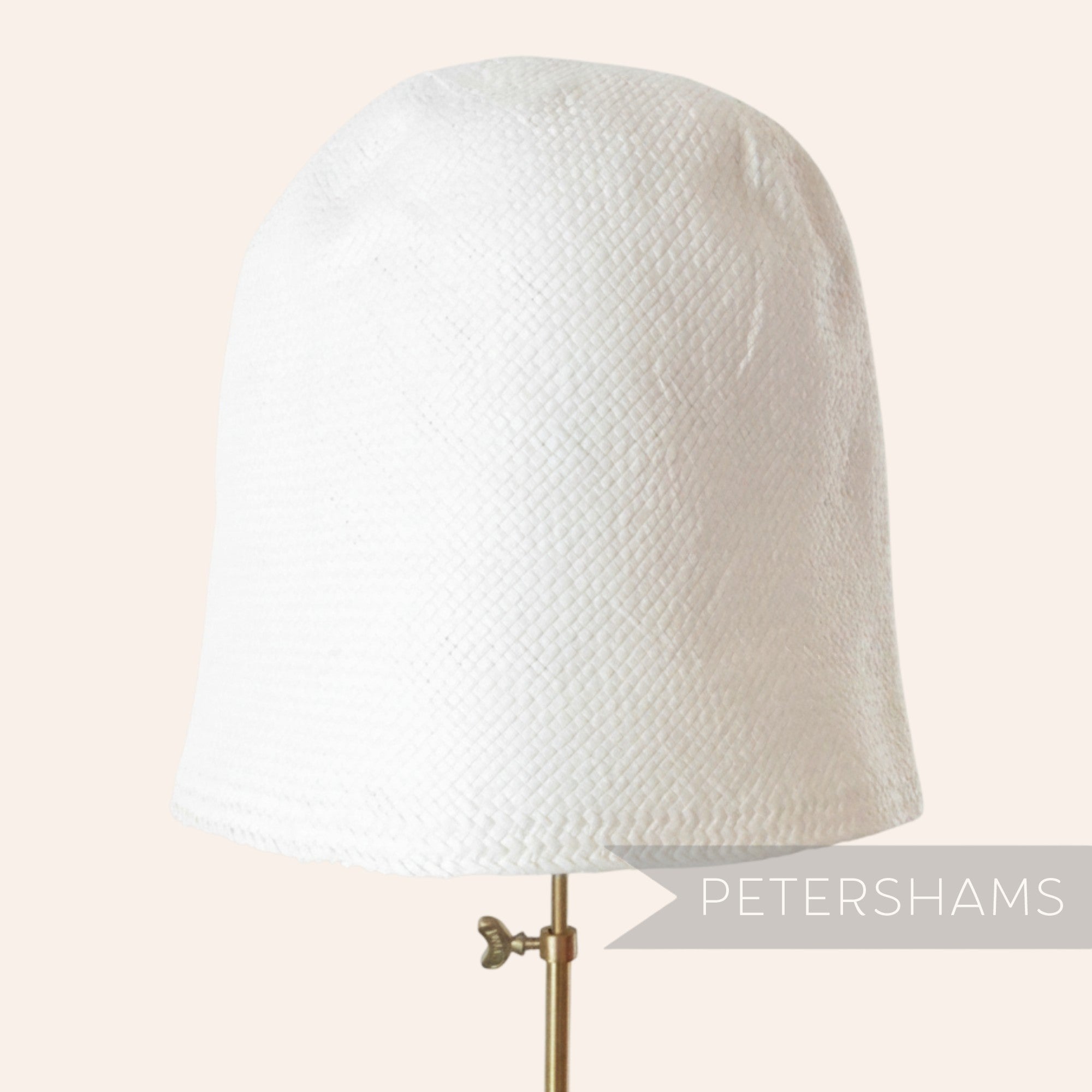 Petershams Millinery Supplies white smooth Toyo paper cone hat body for millinery and hat making projects.
