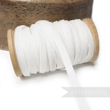 Petershams Millinery Supplies 7mm white vintage rayon velvet ribbon on a wooden spool