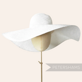 Petershams Millinery Supplies white visca braid capeline hat with an extra large floppy brim on a mannequin head.