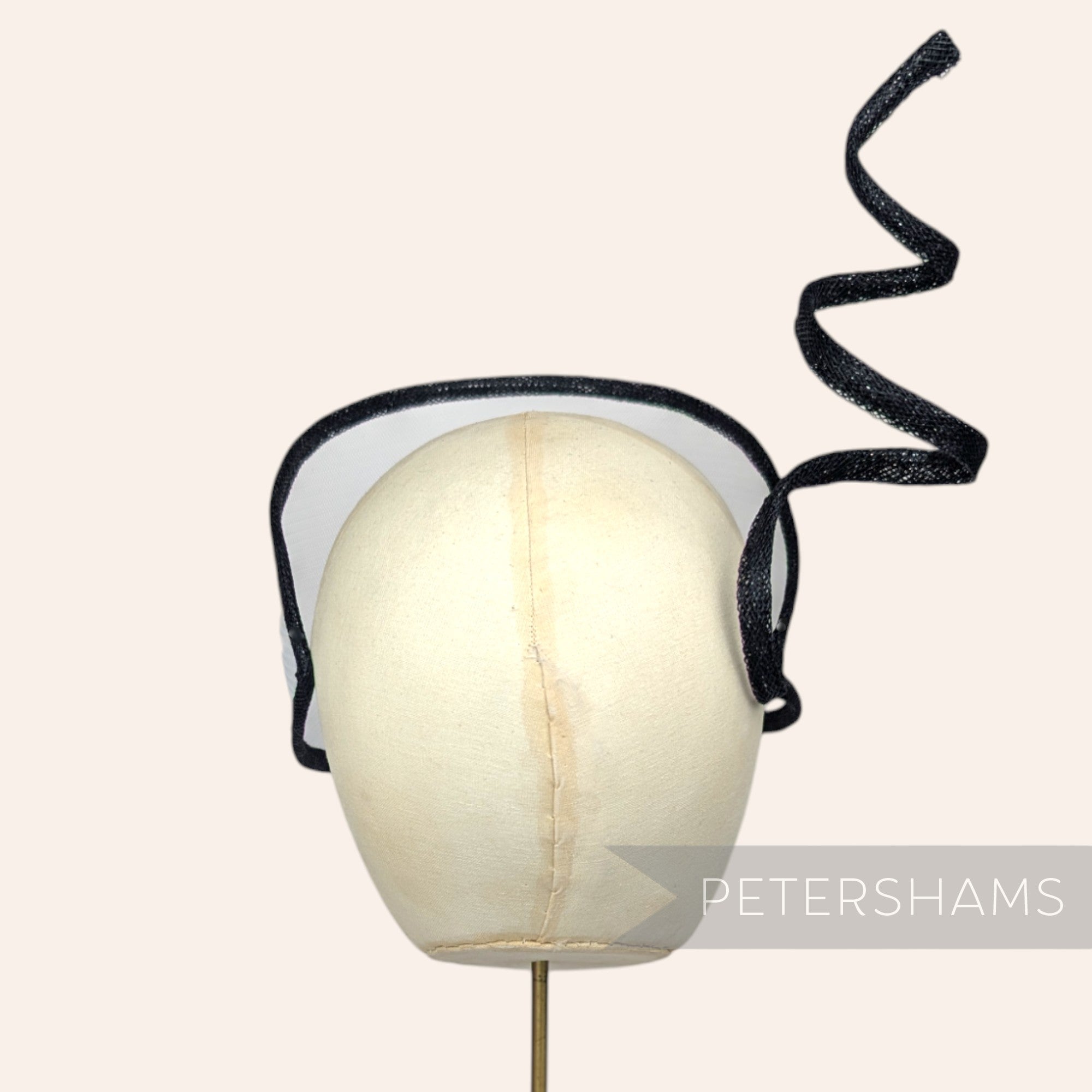 Petershams Millinery Supplies Astra black and white crin and sinamay visor fascinator on a millinery head block