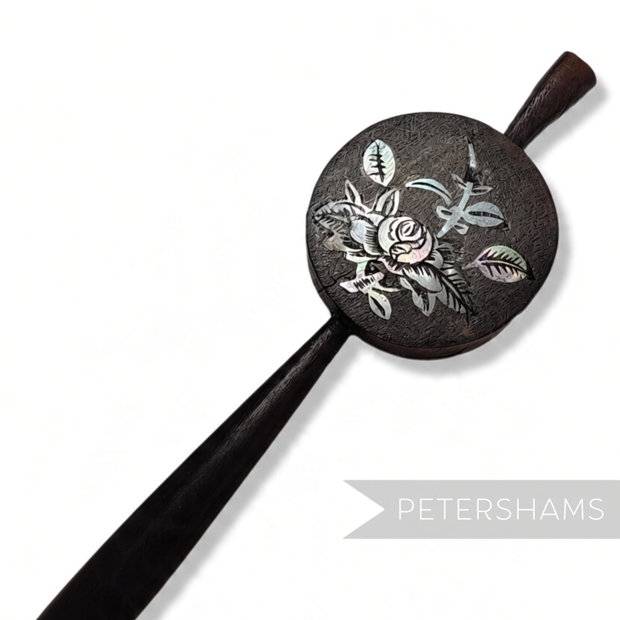 Petershams Millinery Supplies vintage wooden hair stick pin with a circular mother-of-pearl floral inlay design.