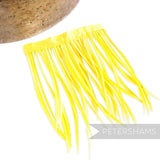 Petershams Millinery Supplies yellow goose biot feather fringe attached to a satin ribbon binding for millinery crafts.