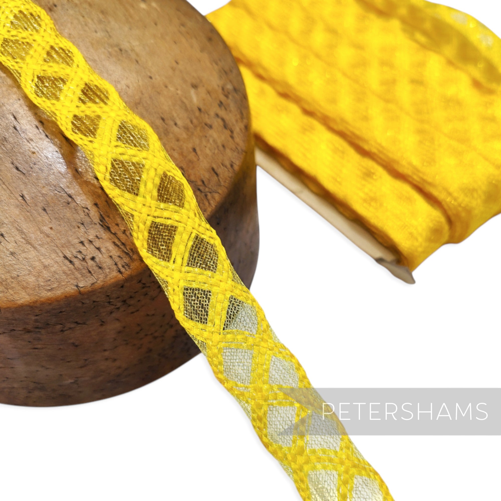 Petershams Millinery Supplies yellow 22mm vintage crinoline trim with a lattice pattern and metallic threads.