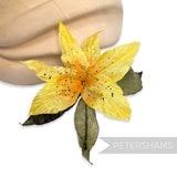 Petershams Millinery Supplies vintage yellow silk lily flower hat mount with hand-painted spots and paper mesh leaves.