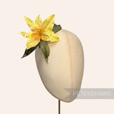Petershams Millinery Supplies vintage silk lily hat mount in yellow with dotted petals and green paper mesh leaves.