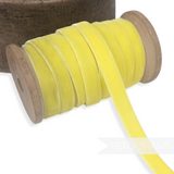 Petershams Millinery Supplies 10mm vintage yellow velvet ribbon wound on a wooden spool for millinery and crafts.
