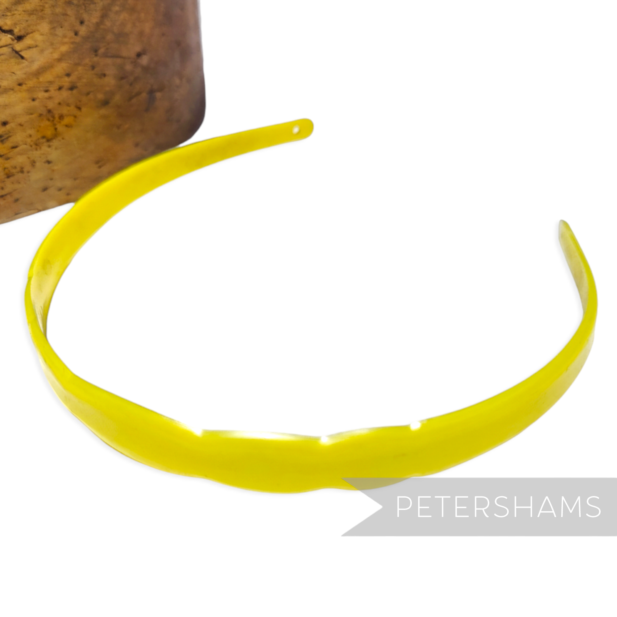 Petershams Millinery Supplies yellow vintage 1960s plastic headband with scallop edge and small holes for attachments.