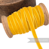 Petershams Millinery Supplies 7mm vintage yellow velvet ribbon on a wooden spool for millinery and craft projects