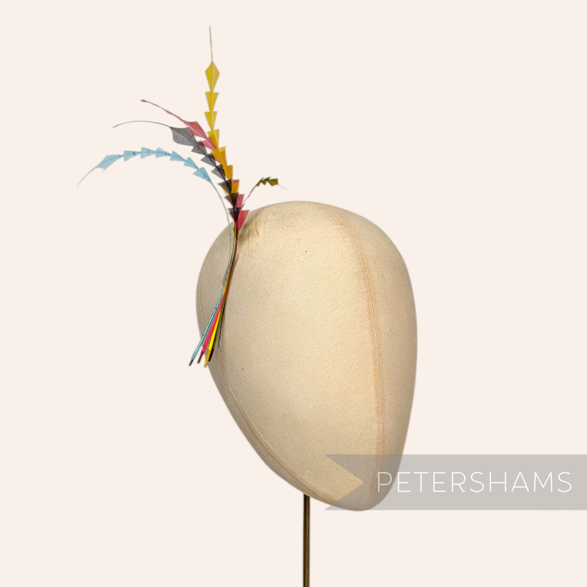 Petershams Millinery Supplies multi-coloured zig zag coque feathers displayed