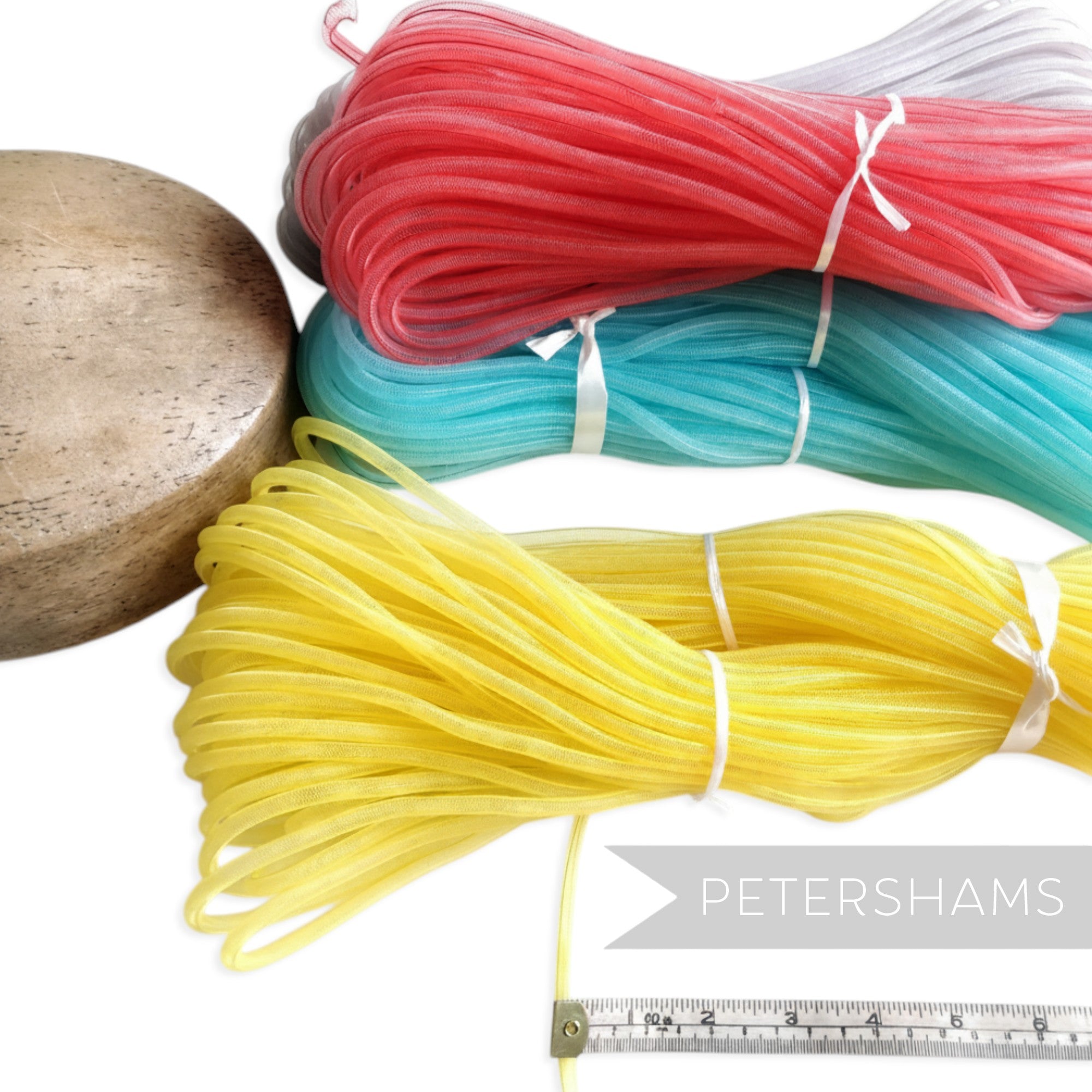 Petershams Millinery Supplies 6mm tube crin in yellow, red, teal and grey. Ideal for structural hat work and trims.