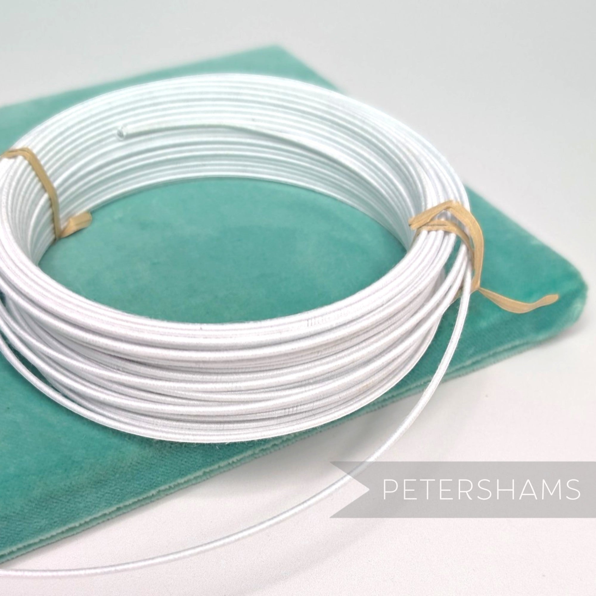 Petershams Millinery Supplies white 1.4mm cotton-covered steel wire for hat bases and forms.