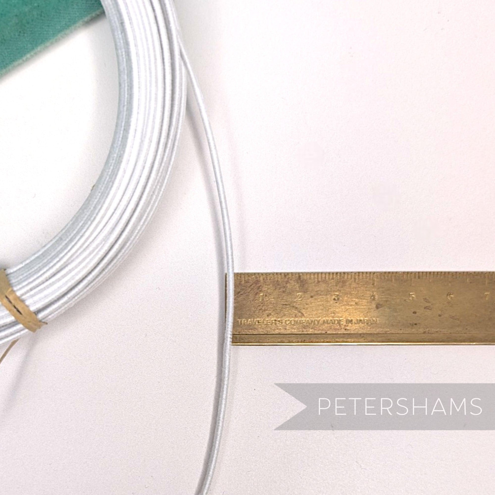 Petershams Millinery Supplies white cotton-covered steel millinery wire, 1.4mm gauge, ideal for hat bases and forms.