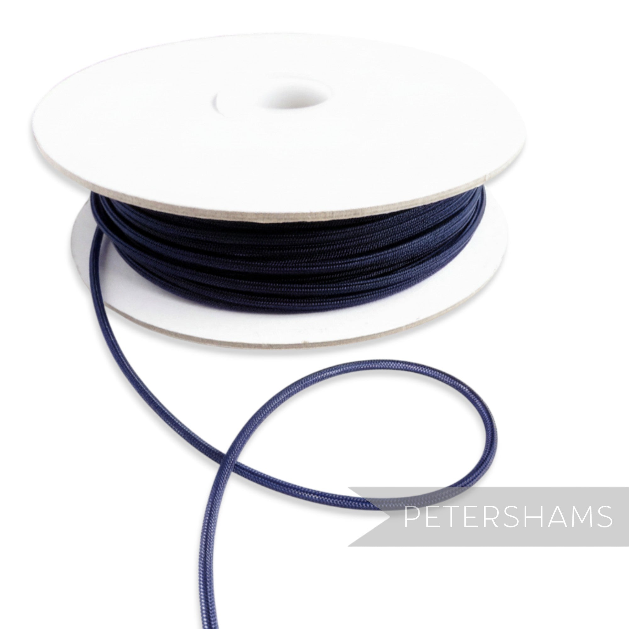 Petershams navy blue 2.5mm tubular millinery crinoline with a central thread for gathering.