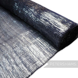 Petershams Millinery Supplies navy blue lurex threaded silk abaca fabric with a shiny, wavy weave.