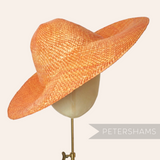 Petershams Millinery Supplies orange wheatstraw capeline hat body with an 11-inch brim, ideal for spring & summer hats.