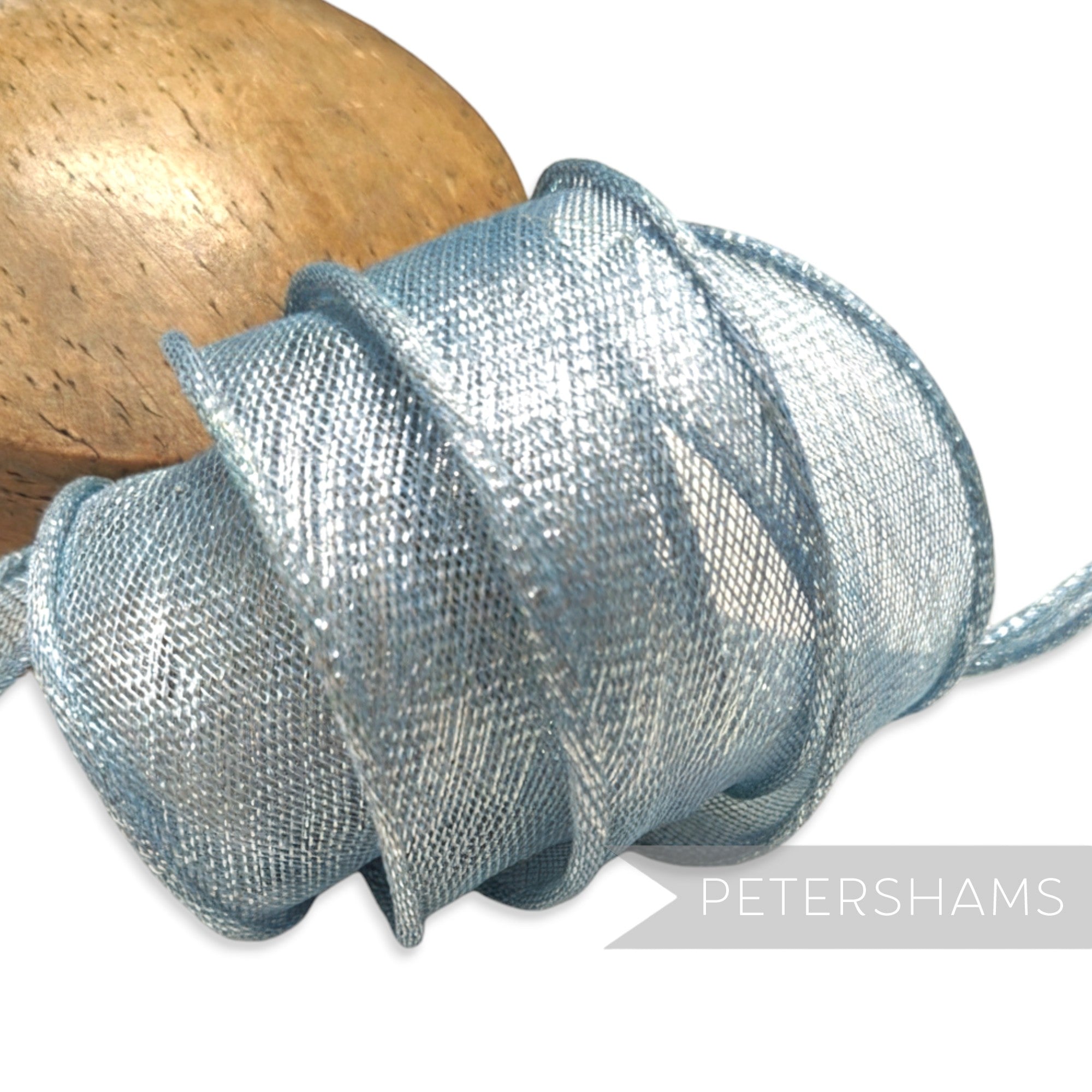 Petershams Millinery Supplies pale blue metallic lurex sinamay ribbon trim with hand-rolled edges, perfect for hat making.
