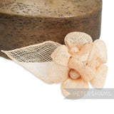 Petershams Millinery Supplies pale peach sinamay hat mount with triple flowers and leaf detail.