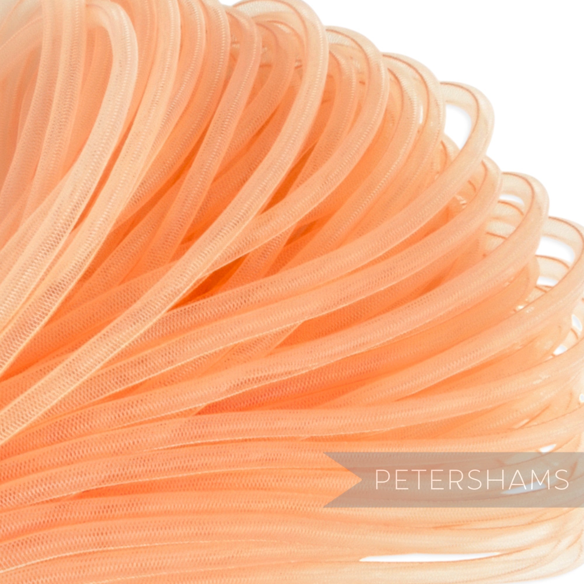 Petershams peach 6mm tube crin netting for millinery and hat making. Slightly sheer with gathered threads.