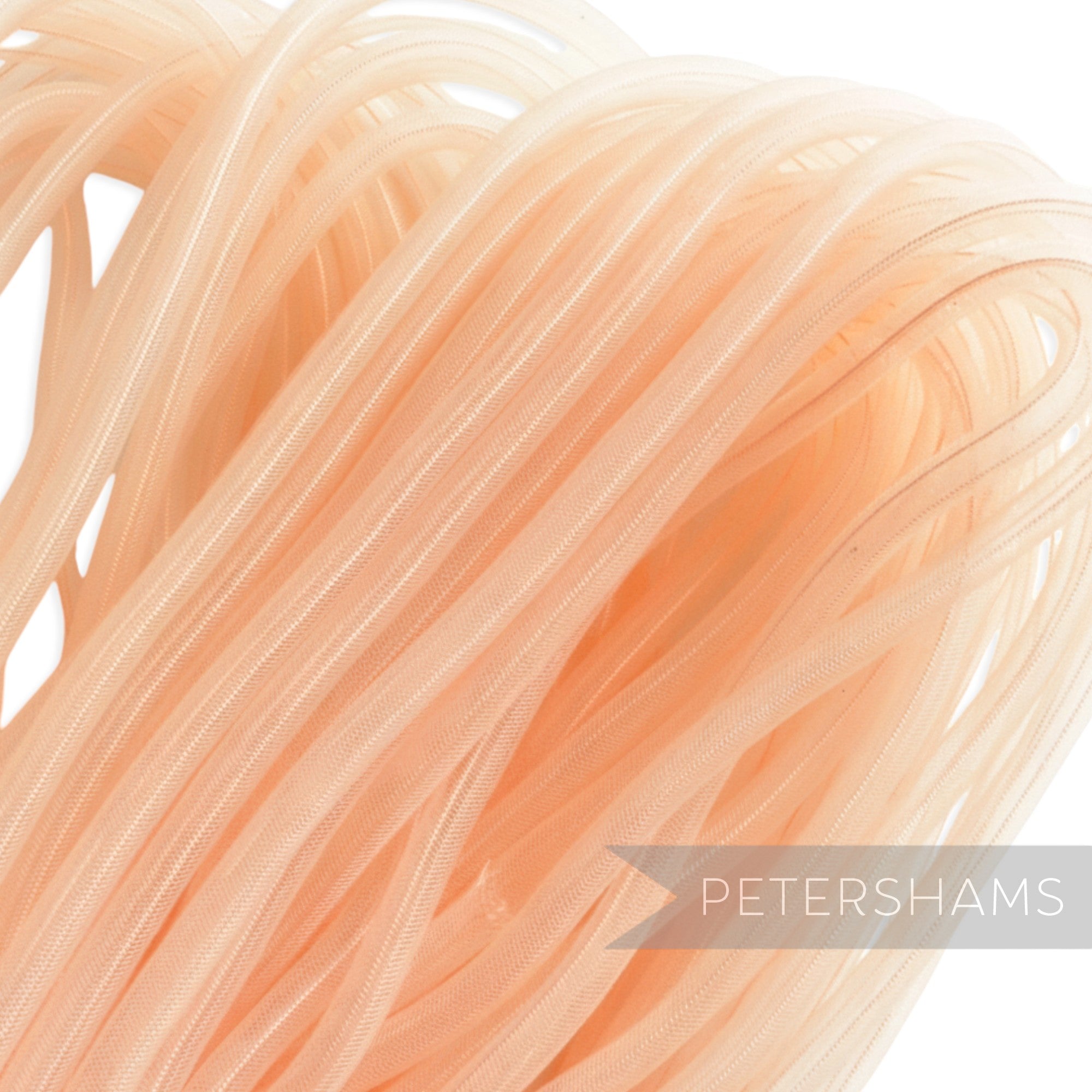 Petershams peach 8mm tube millinery crin, a sheer tubular mesh for hat making and trims.
