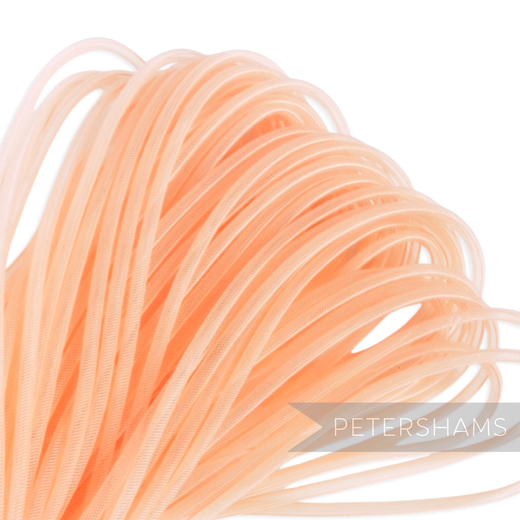 Petershams pale peach 4mm tube millinery crinoline, a sheer mesh trim ideal for hat making and decorative accents.