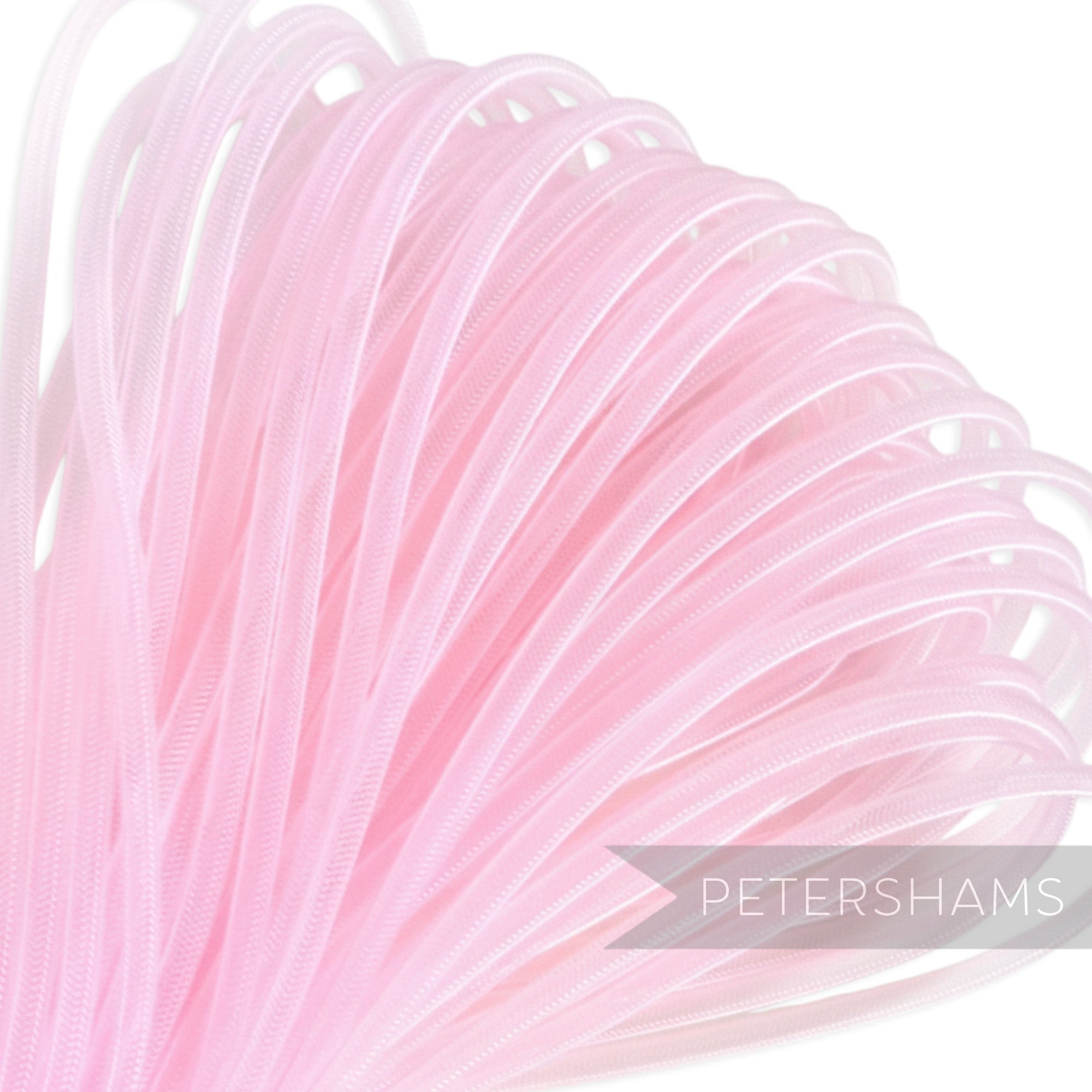 Petershams pink 6mm tube millinery crin for hat making and trims. Slightly sheer with gathered sides.