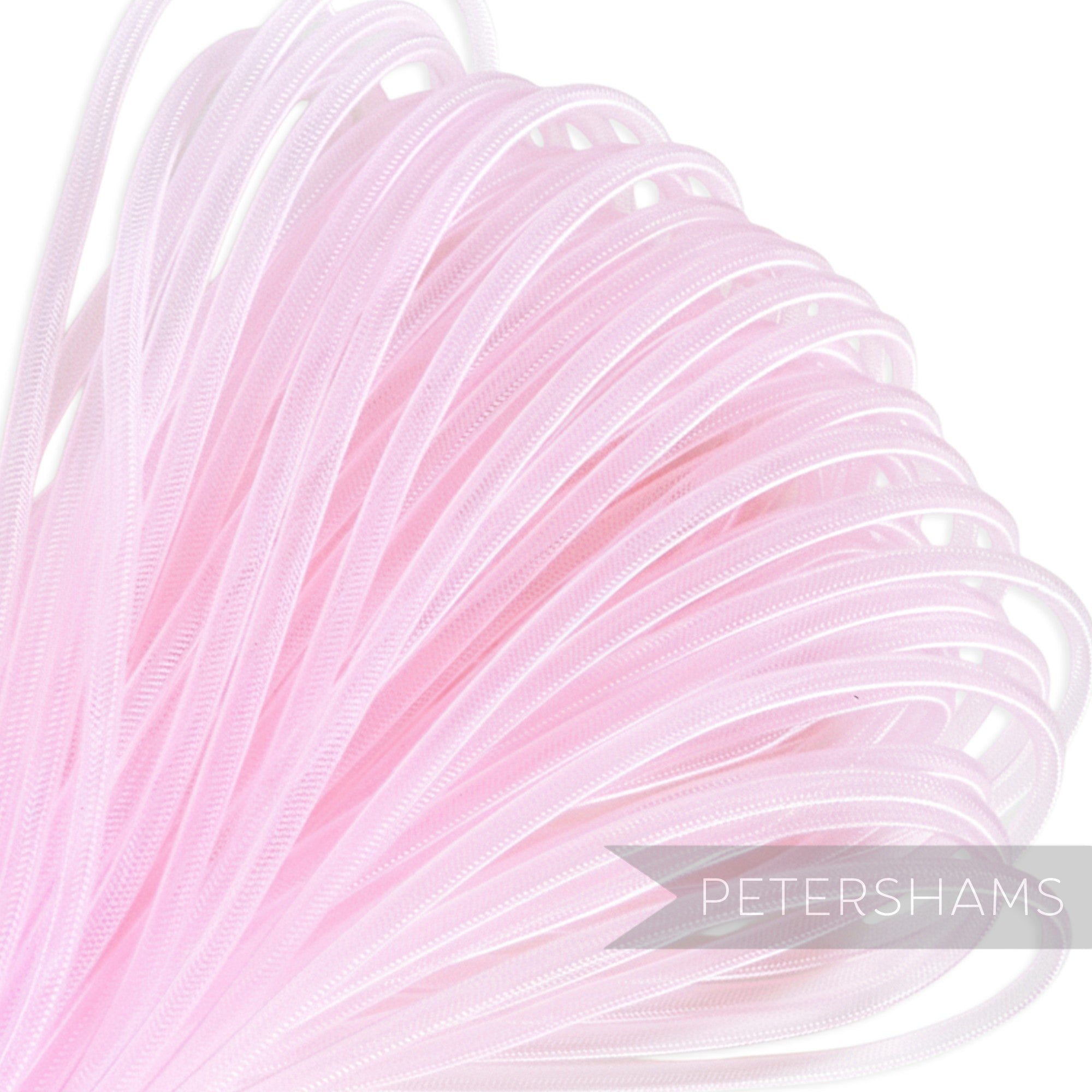 Petershams pink 4mm tube millinery crinoline trim, slightly sheer with a gathered thread.