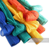 Petershams Millinery Supplies polyester abaca fabric in blue, teal, yellow, orange, and mint green. Woven with polyester threads for a slight sheen.