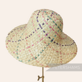 Petershams Millinery Supplies natural straw capeline hat body with pink, purple, and jade woven details. 11-inch brim.