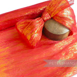 Petershams red and gold lurex threaded silk abaca fabric with a wavy weave, perfect for millinery.