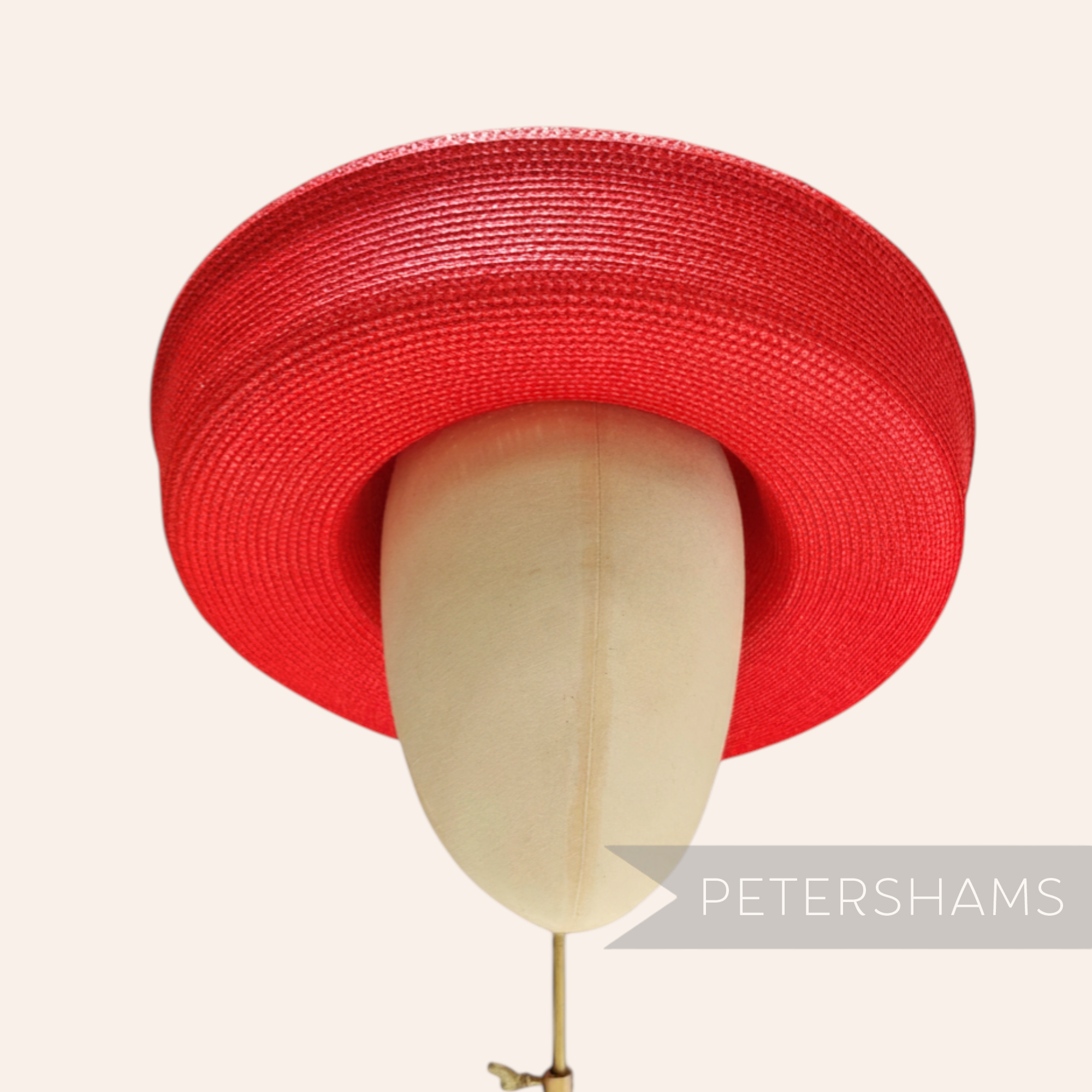 Petershams red polybraid sailor hat form with a large upturned brim, ideal for occasion wear.