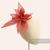 Petershams Millinery Supplies red layered sinamay flower hat mount with loops and leaves. Approx 25cm wide.