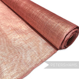 Petershams Millinery Supplies rose gold sinamay fabric threaded with metallic lurex, ideal for hat making.