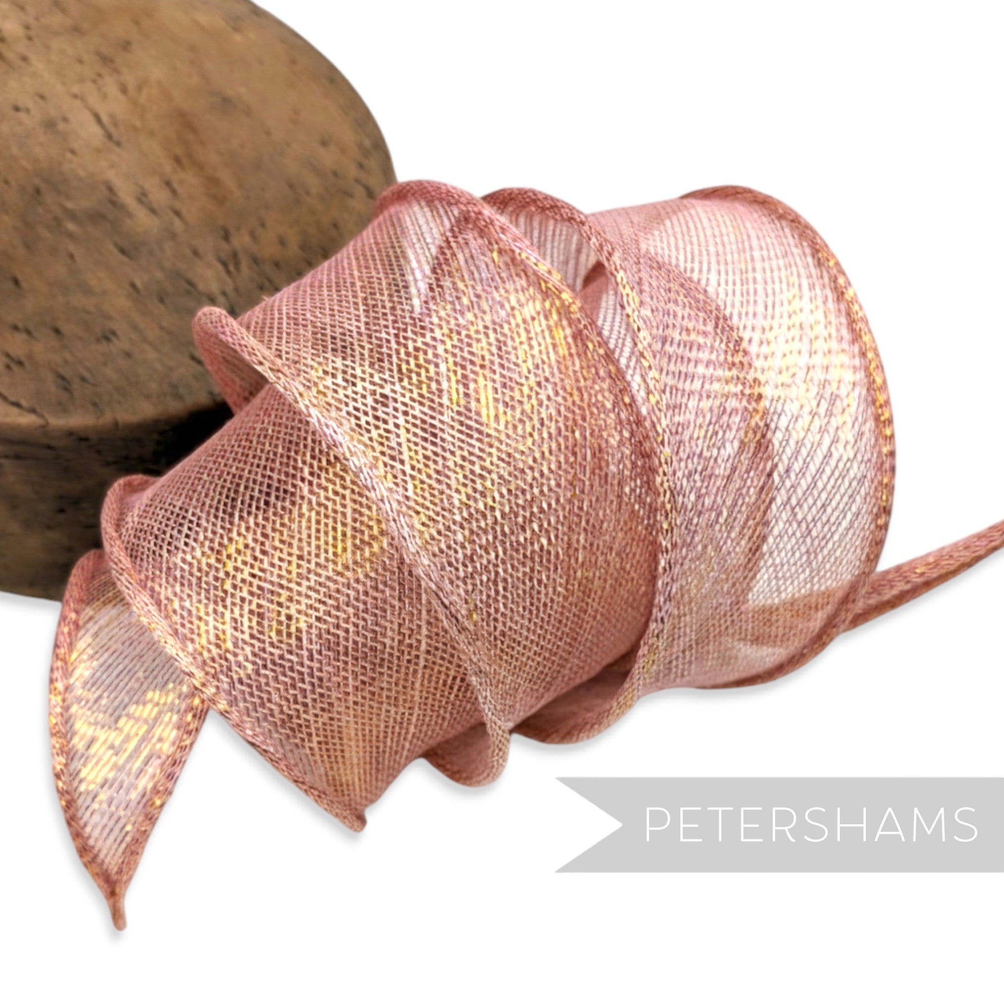 Petershams Millinery Supplies rose gold metallic lurex sinamay ribbon trim with hand-rolled edges.
