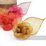 Petershams Millinery Supplies 'Zoe' sinamay hat mount with triple flowers and leaf backing in red, orange, pink, and gold.