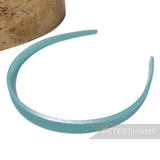 Petershams Millinery Supplies vintage 1960s teal skinny headband with fine grid pattern and small holes for attachments.