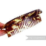 Petershams Millinery Supplies vintage faux tortoise plastic bun comb, 1960s/70s style, flexible for updos or tiaras.